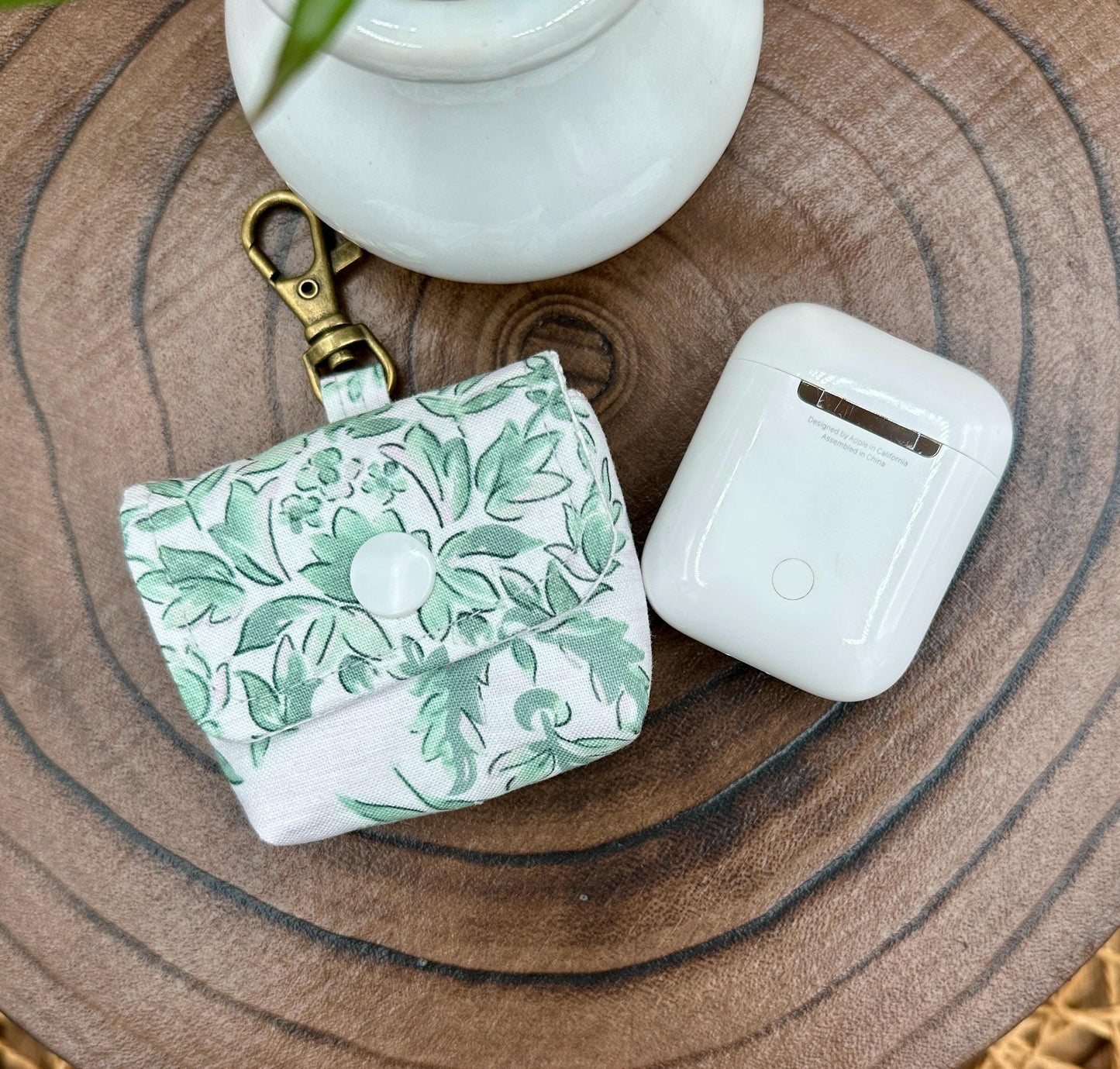 Wireless earbud case, Elegant Green Floral fabric with snap closure and swivel clasp for protection and convenience, 3X3X.75"