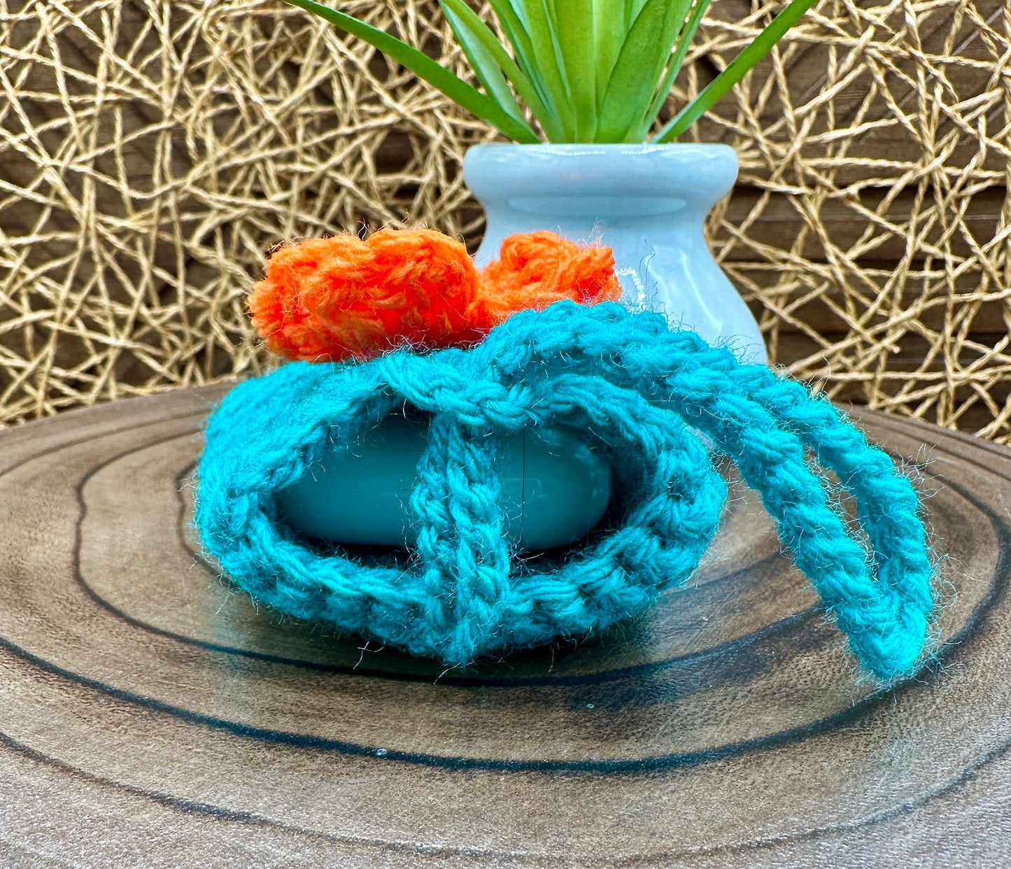 Blue Crocheted Wireless earbud case, compatible with AirPods, measures 3 T 3 H .25 D, Pretty Raised Orange Flower Granny Square Design