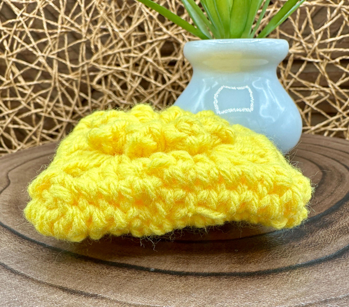Yellow Crocheted Wireless earbud case, compatible with AirPods, measures 3 T 3 H .25 D, Pretty Raised Flower Granny Square Design