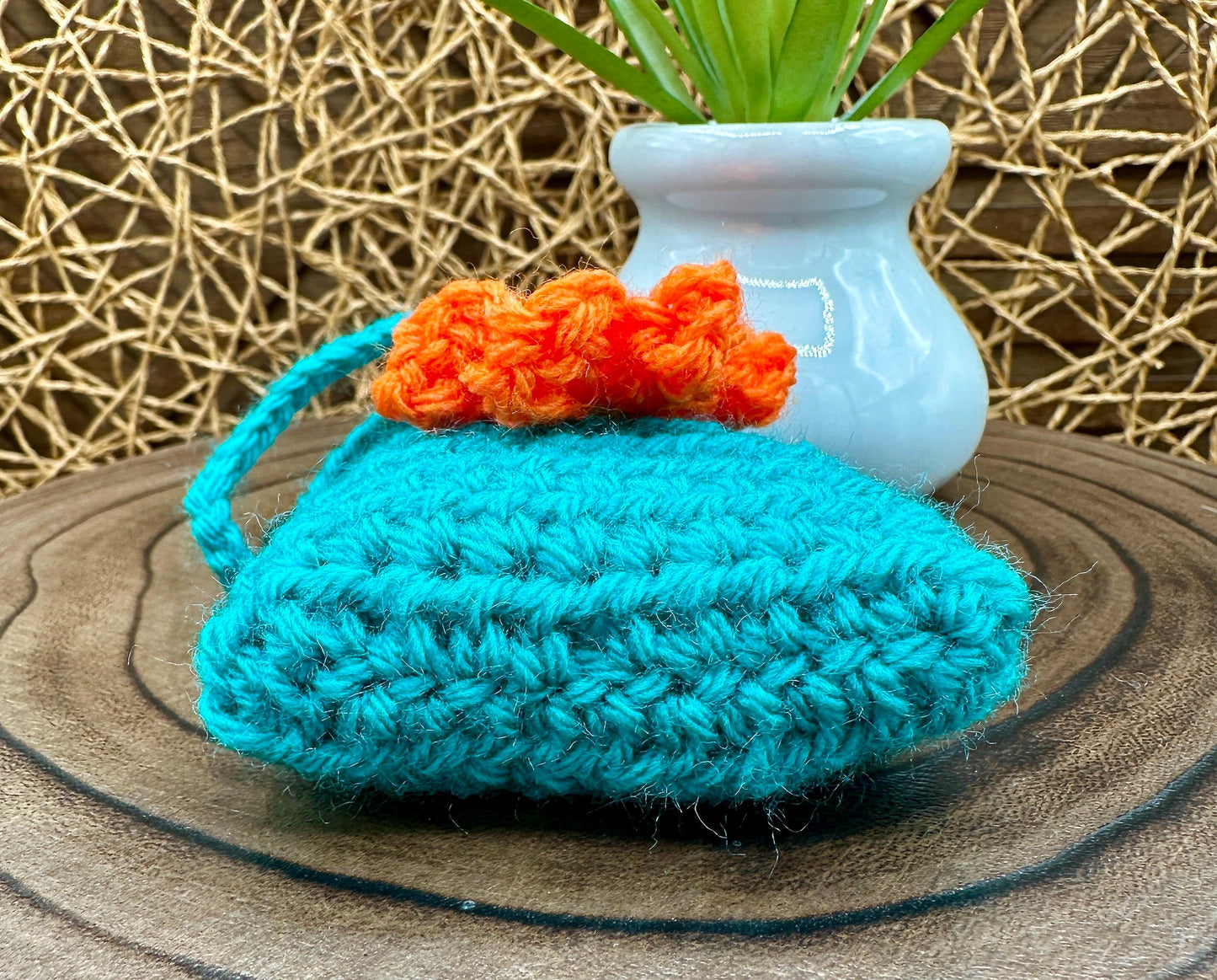 Blue Crocheted Wireless earbud case, compatible with AirPods, measures 3 T 3 H .25 D, Pretty Raised Orange Flower Granny Square Design