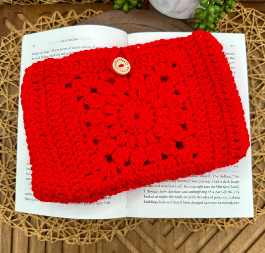 red granny square crocheted book sleeve