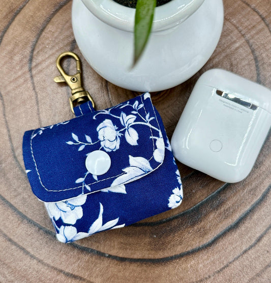Wireless earbud case, Elegant Navy fabric with White flowers with snap closure and swivel clasp for protection and convenience, 3X3X.75"