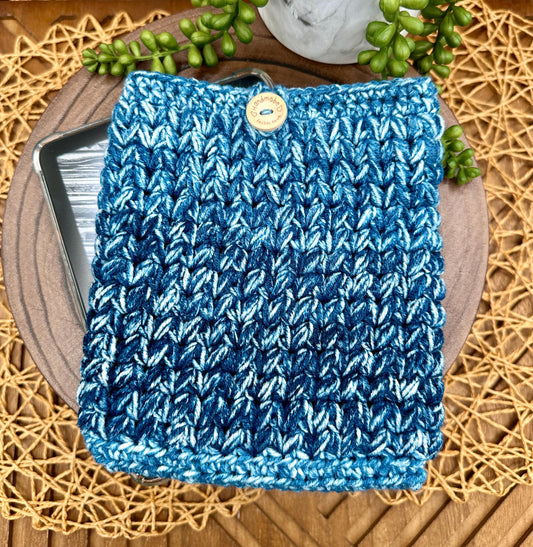 blue multi-colored crocheted kindle paperwhite sleeve with wood button closure