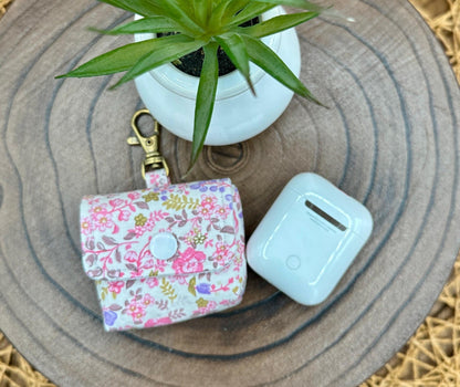 Wireless earbud case, Dainty Lilac and Pink floral fabric with snap closure and swivel clasp for added protection and convenience, 3X3X.75"