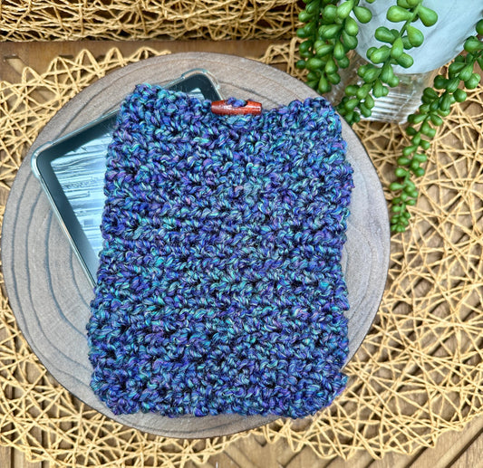 purple and green crocheted kindle sleeve with wood toggle button closure