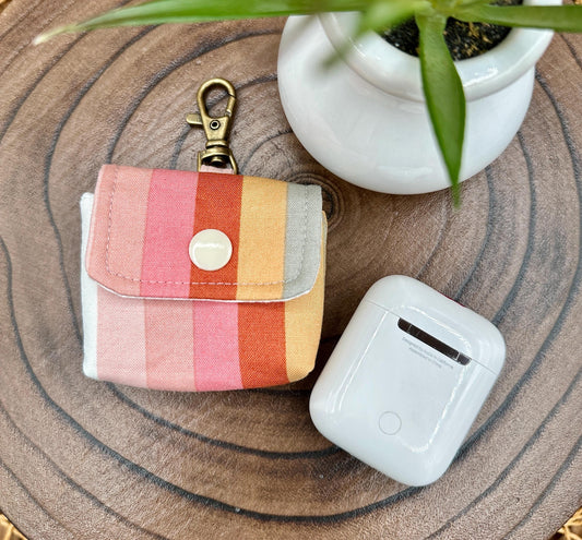 Wireless earbud case, pastel striped fabric with snap closure and swivel clasp for added protection and convenience, 3X3X.75"