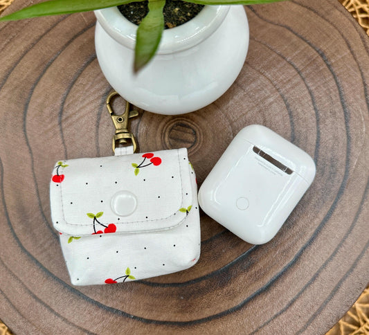 Wireless earbud case, Red Cherry Print Fabric with snap closure and swivel clasp for added protection and convenience, 3X3X.75"