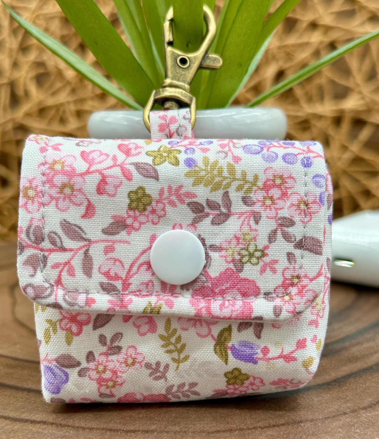 Wireless earbud case, Dainty Lilac and Pink floral fabric with snap closure and swivel clasp for added protection and convenience, 3X3X.75"