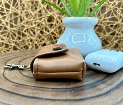 Brown Faux Leather Wireless earbud case, compatible with AirPods, snap closure swivel clasp included for easy and secure carry, 3X3X.75"