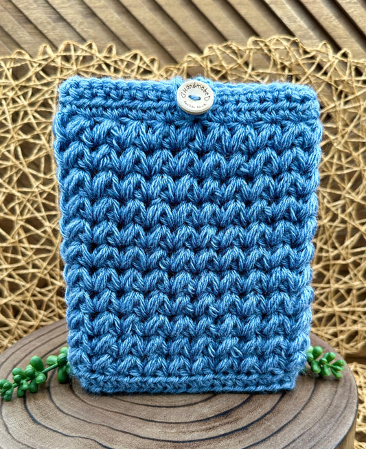 blue crocheted kindle paperwhite sleeve with wood button closure