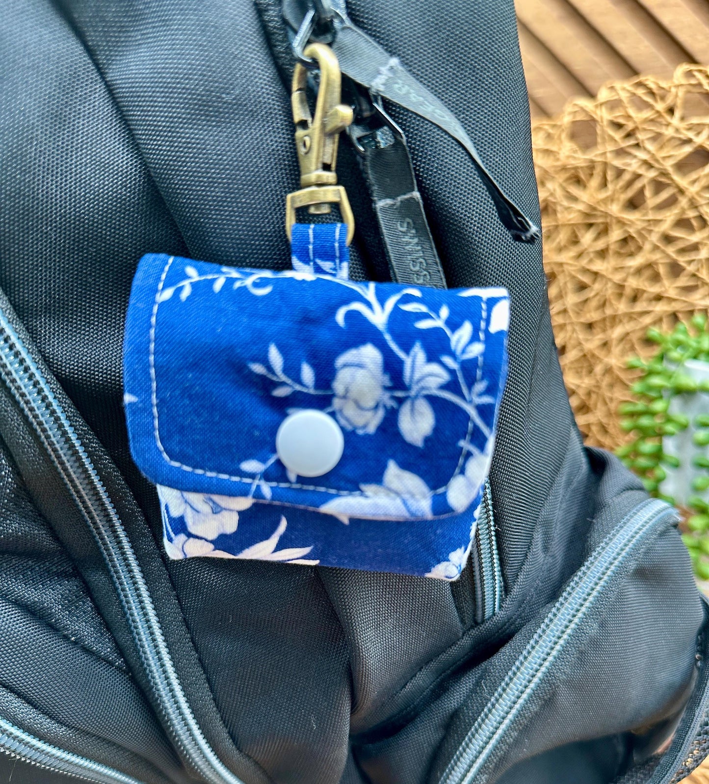 Wireless earbud case, Elegant Navy fabric with White flowers with snap closure and swivel clasp for protection and convenience, 3X3X.75"
