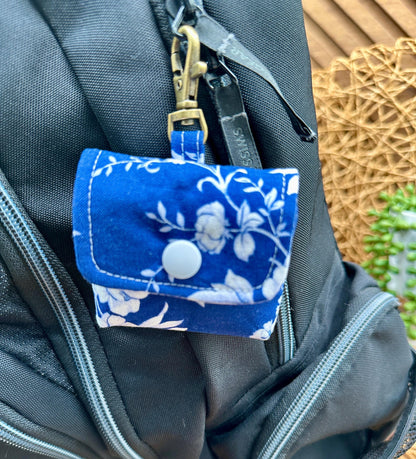 Wireless earbud case, Elegant Navy fabric with White flowers with snap closure and swivel clasp for protection and convenience, 3X3X.75"