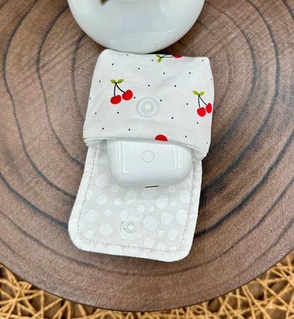 Wireless earbud case, Red Cherry Print Fabric with snap closure and swivel clasp for added protection and convenience, 3X3X.75"