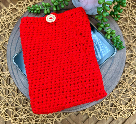 red crocheted kindle sleeve with wood button closure