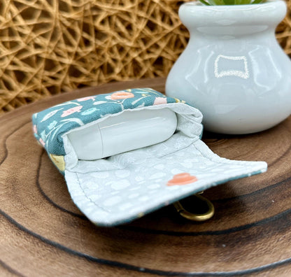 Wireless earbud case, Boho Green Floral fabric with snap closure and swivel clasp for protection and convenience, 3X3X.75"
