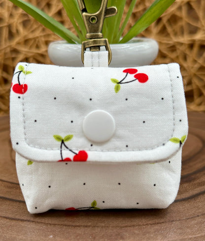 Wireless earbud case, Red Cherry Print Fabric with snap closure and swivel clasp for added protection and convenience, 3X3X.75"