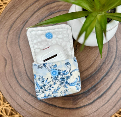 Wireless earbud case, elegant blue floral fabric with snap closure and swivel clasp for added protection and convenience, 3X3X.75"