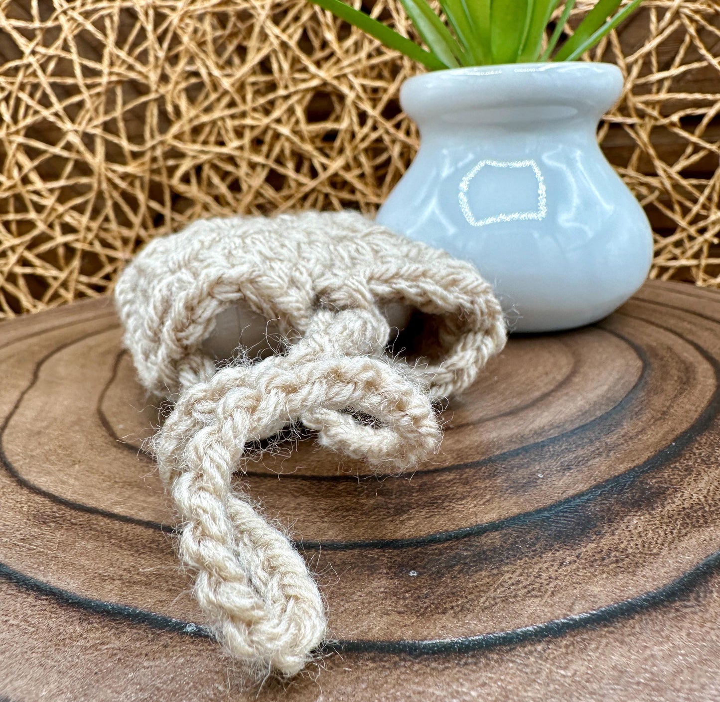 Beige Crocheted Wireless earbud case, compatible with AirPods, measures 3 T 3 H .25 D, Granny Square Design