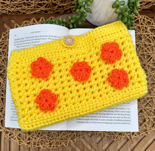 Yellow Crocheted book sleeve with orange flowers