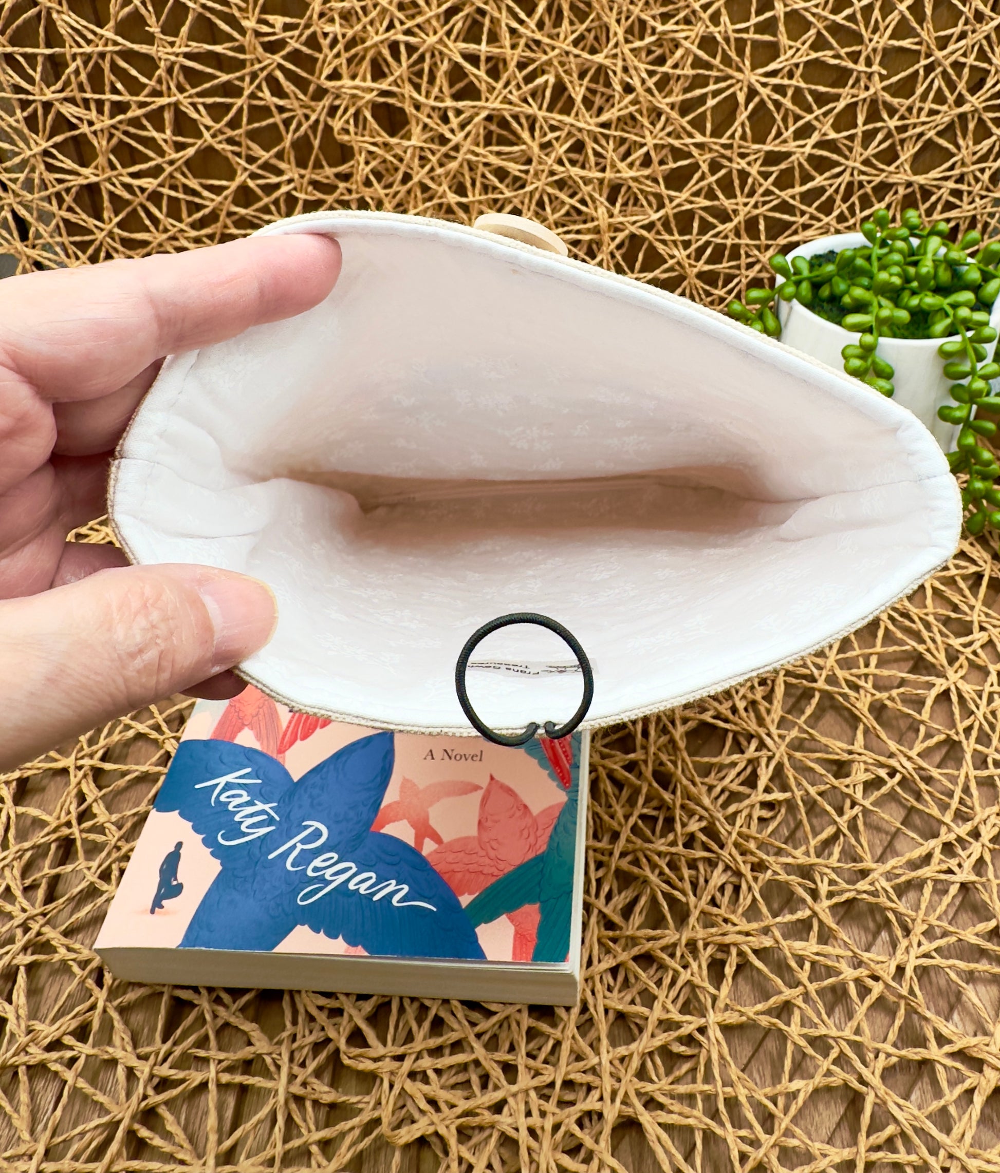 inside book sleeve features a pretty white cotton interior with dainty white flowers