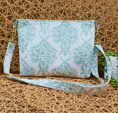 Green floral print east west everyday crossbody bag with adjustable and removable strap, gold hardware