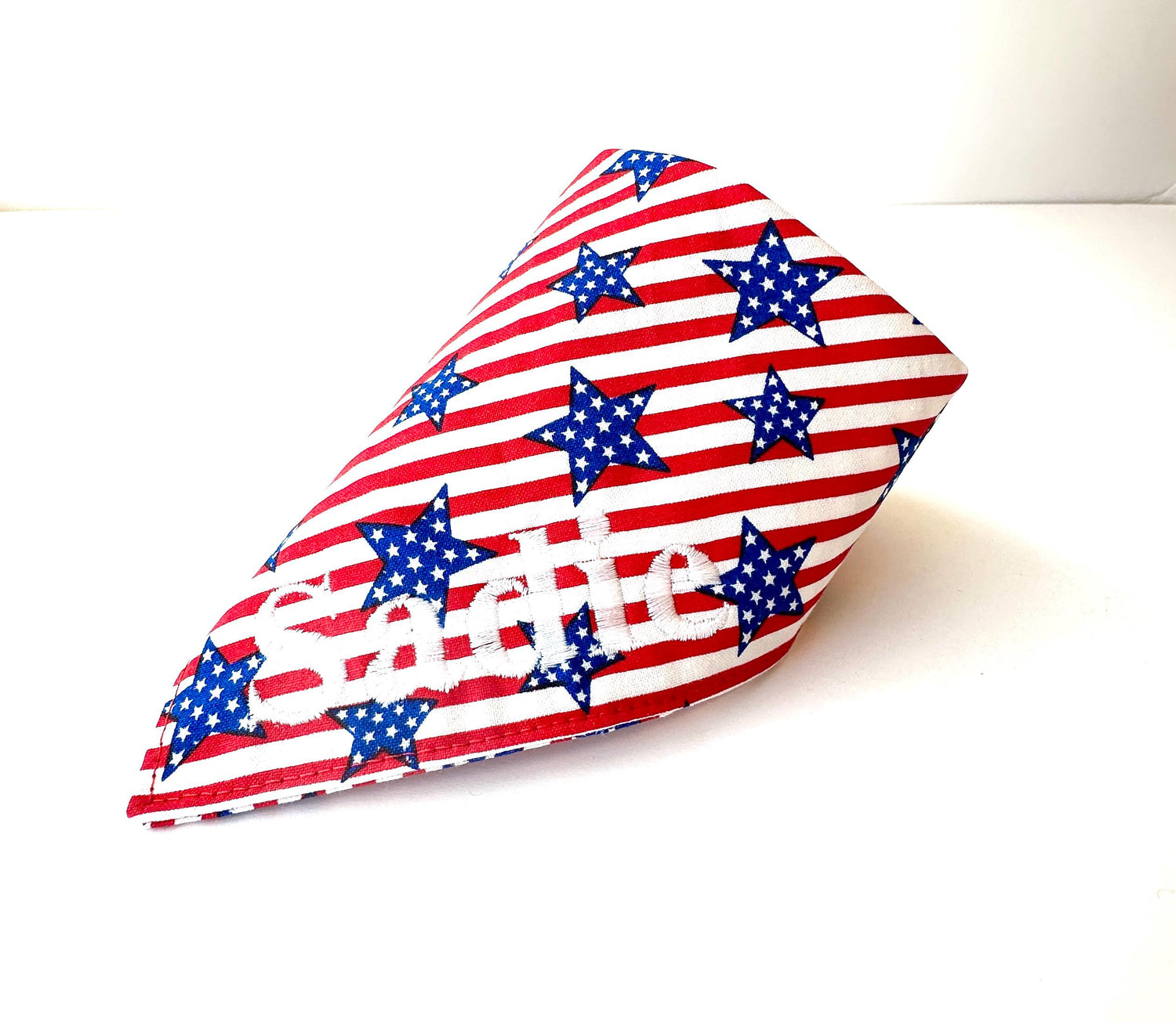 Personalized red and white stripes with blue stars dog bandana. Snap closure