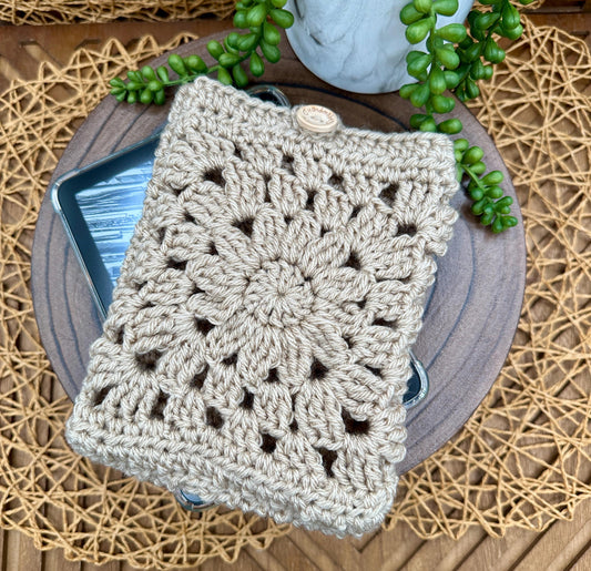 beige granny square kindle paperwhite sleeve with a wood button closure