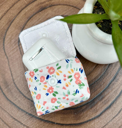 Wireless earbud case, Dainty Pink floral fabric With Blue Leaves; snap closure and swivel clasp for stylish convenience and security 3X3X.75