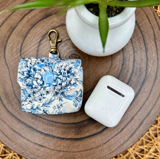 Wireless earbud case, elegant blue floral fabric with snap closure and swivel clasp for added protection and convenience, 3X3X.75"