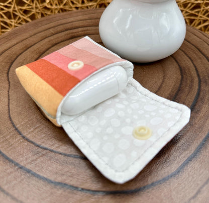 Wireless earbud case, pastel striped fabric with snap closure and swivel clasp for added protection and convenience, 3X3X.75"