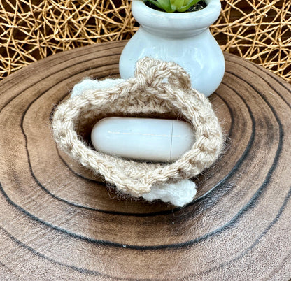 Beige Crocheted Wireless earbud case, compatible with AirPods, measures 3.25 W 2.75 H .5 D