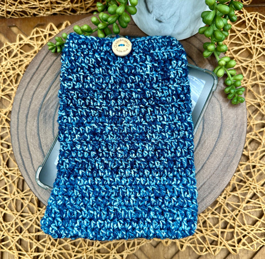 Blue multi-colored crocheted kindle sleeve with wood button closure