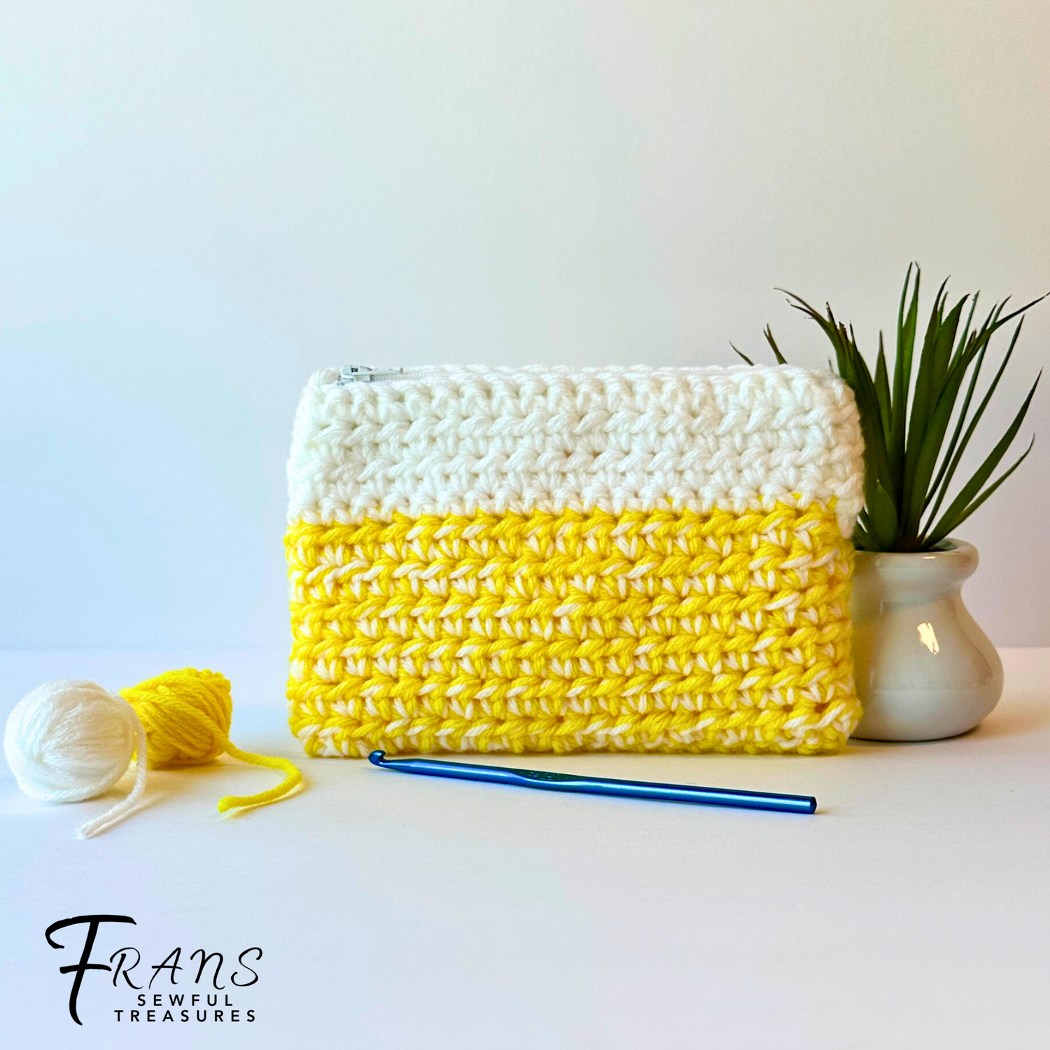 yellow and white crocheted zipper pouch made with 2 strands of yarn for extra thickness